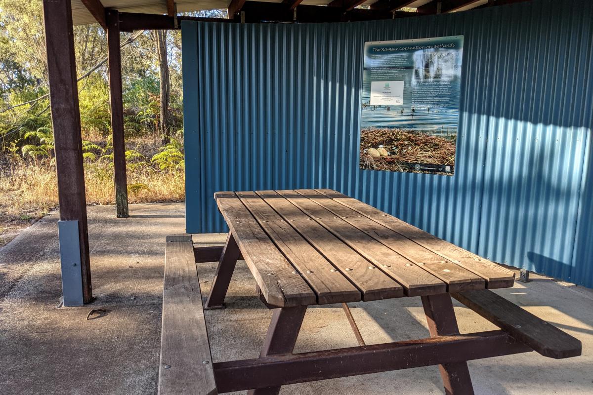 Undercover picnic area at the Lake Muir Observatory Undercover picnic area with a wooden bench at the Lake Muir Observatory