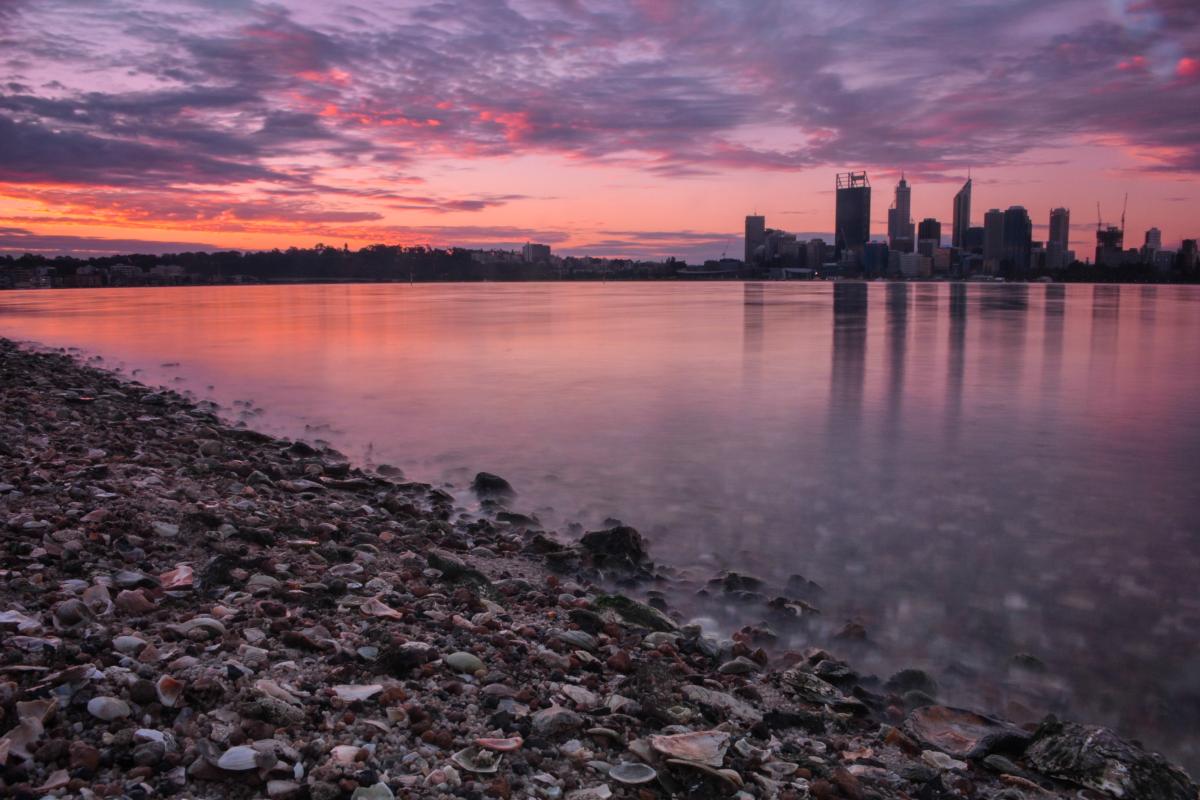South Perth Swan Canning Riverpark Stunning sunset overlooking the South Perth foreshore with the silhouette of the city in the distance.