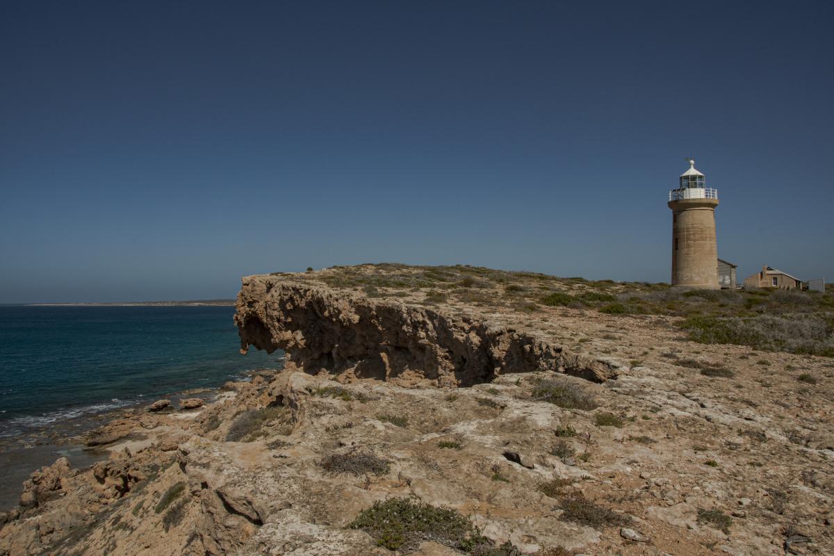 Cape Inscription - Dirk Hartog Island National Park lighthouse and old buildings by the cliff edge at cape inscription