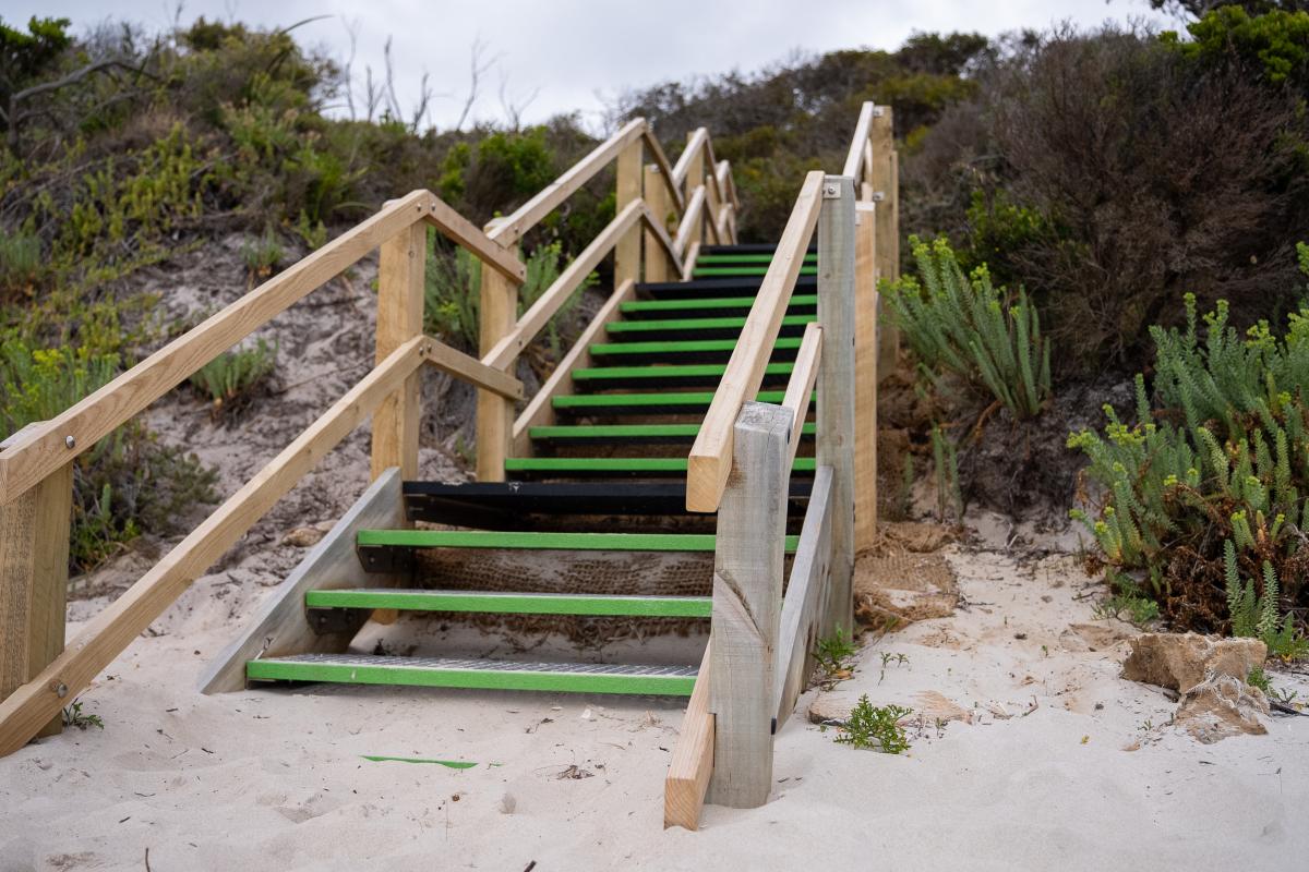 Misery Beach Wooden steps leading onto sand.
