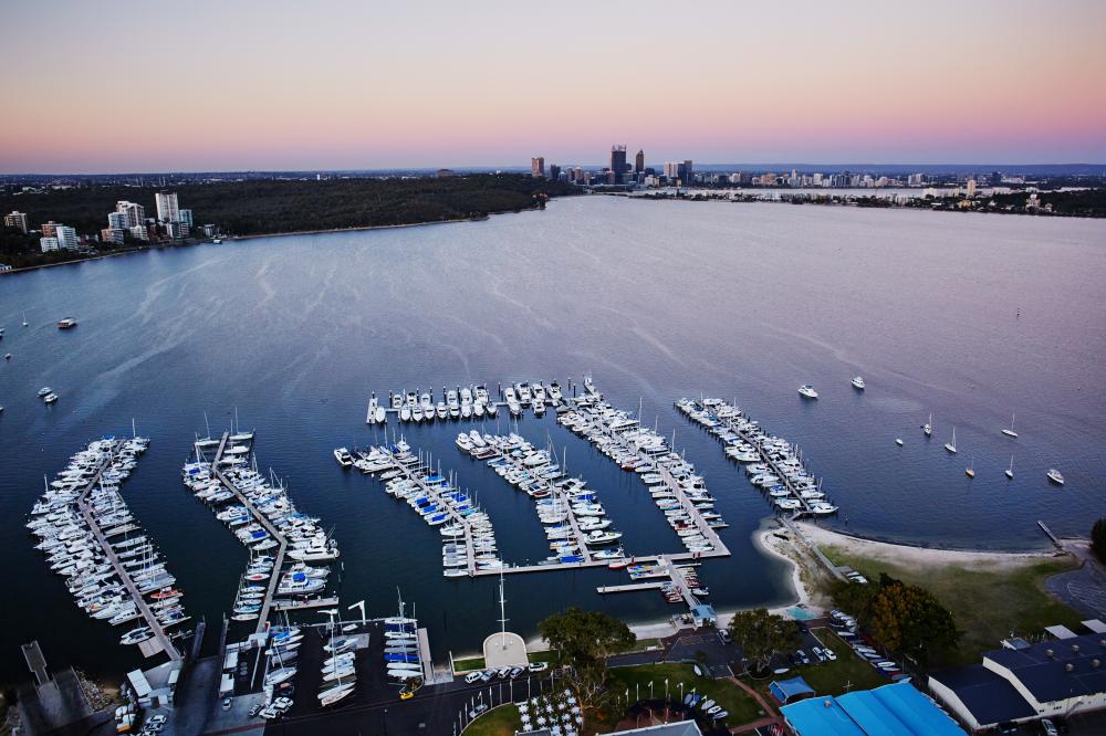 Aerial view of Swan River and Perth city skyline at sunset