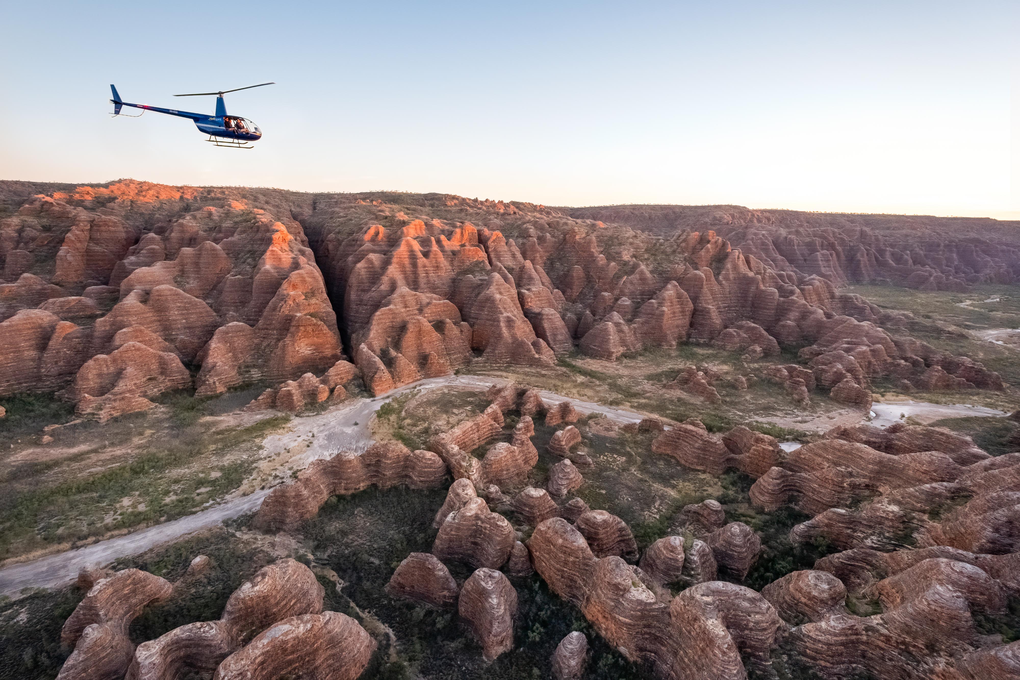 Helispirit helicopter flying over the Bungle Bungle Range.