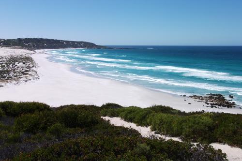 sweeping ocean vista of Hamersley Beach with white sand and expanse of blue sea