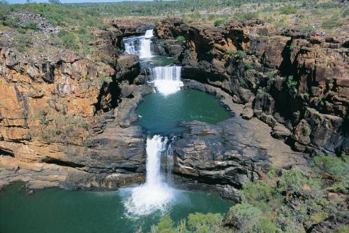 View of Mitchell Falls cascading down three levels of rocks and rock pools