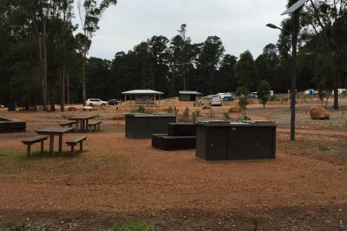 picnic tables and bbq cookers in a campground at Nanga Brook