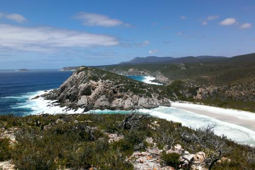 Rugged coastline with rocky headlands white sand and deep blue water