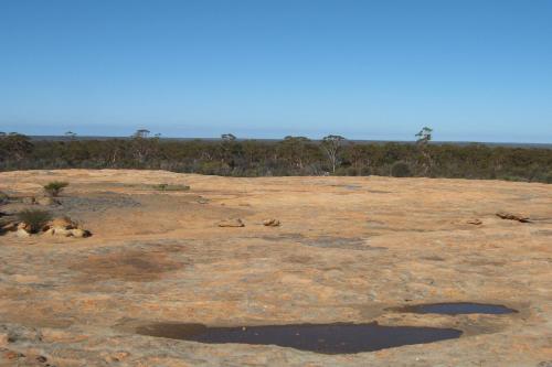 Thursday Rock with an expanse of native outback bushland in the distance