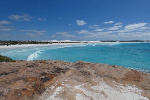 sweeping bay and turquoise ocean and Dunn Rocks