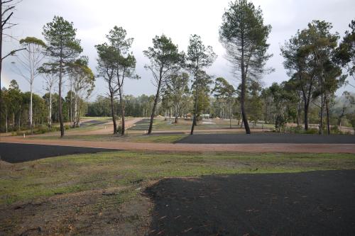 Well set out camping areas with grass and trees