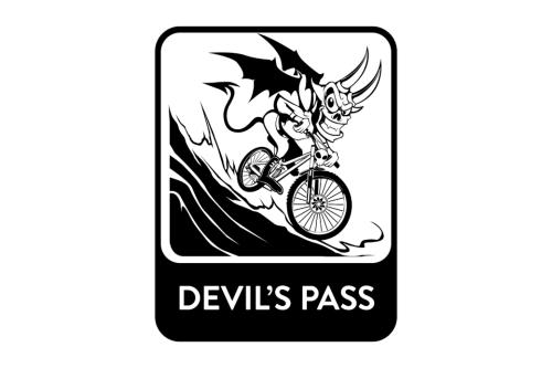 Black and white graphic of a devil riding downhill on a mountain bike. 