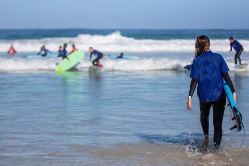 People surfing at the beach.