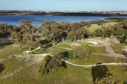 Aerial view of person riding bike on trails. 