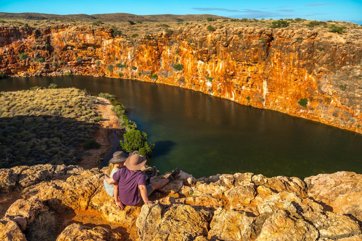 View of Yardie Creek Gorge in Cape Range National Park 2 people looking out over Yardie Creek Gorge in Cape Range National Park