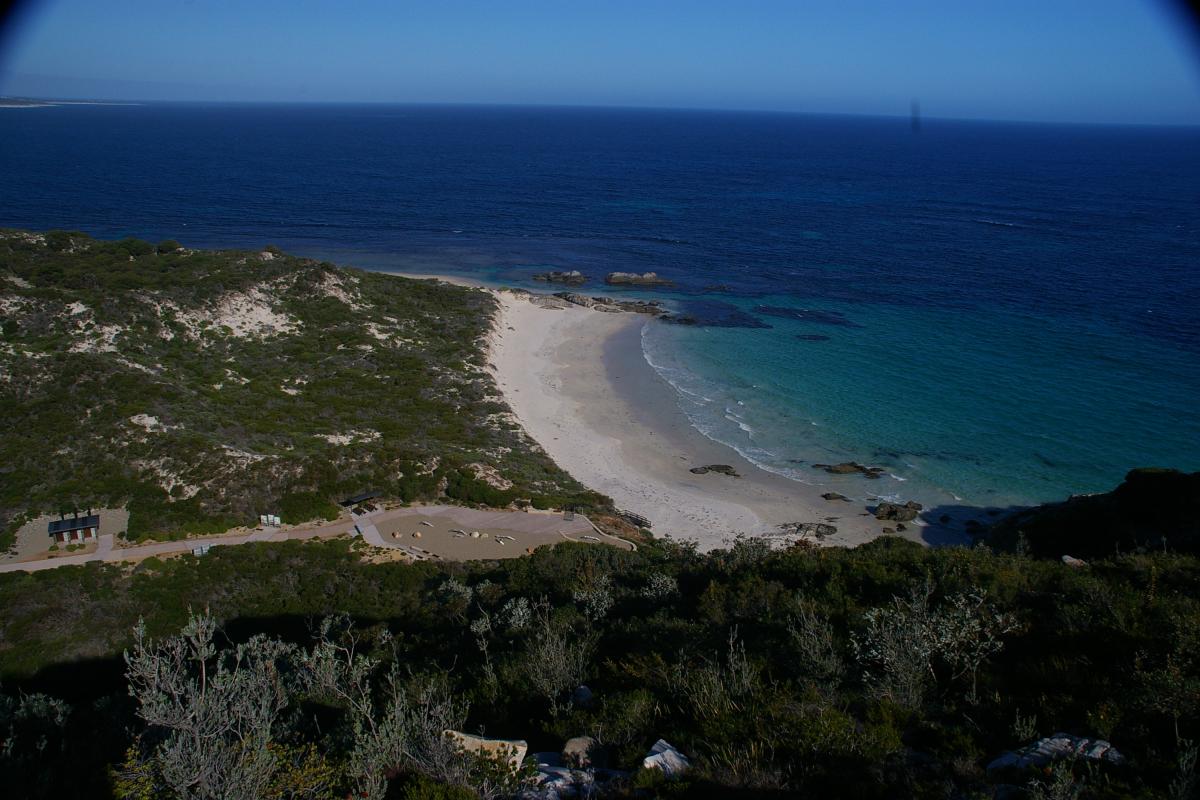 views over the coastline with deep blue ocean and bright blue skies