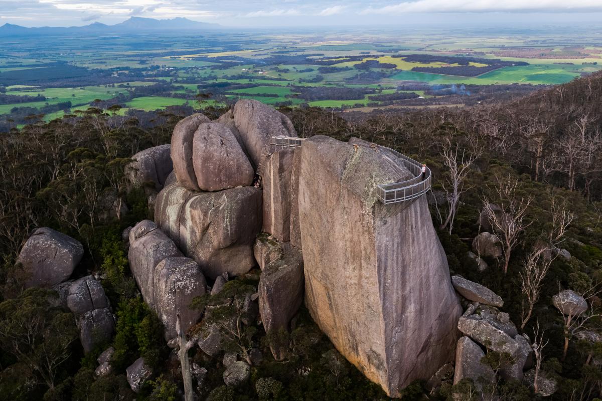 aerial view of large granite rock with metal platform on the side