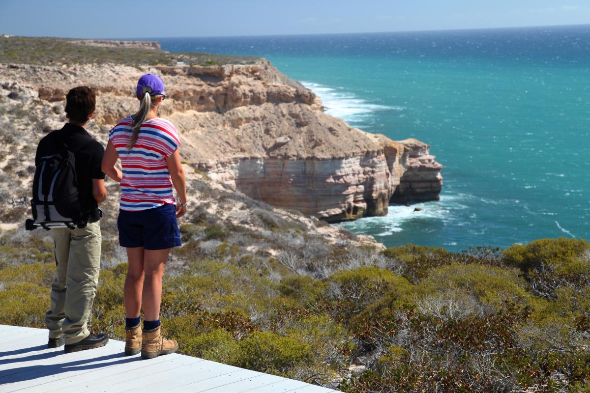 Visitors standing on platform overlooking Island Rock 