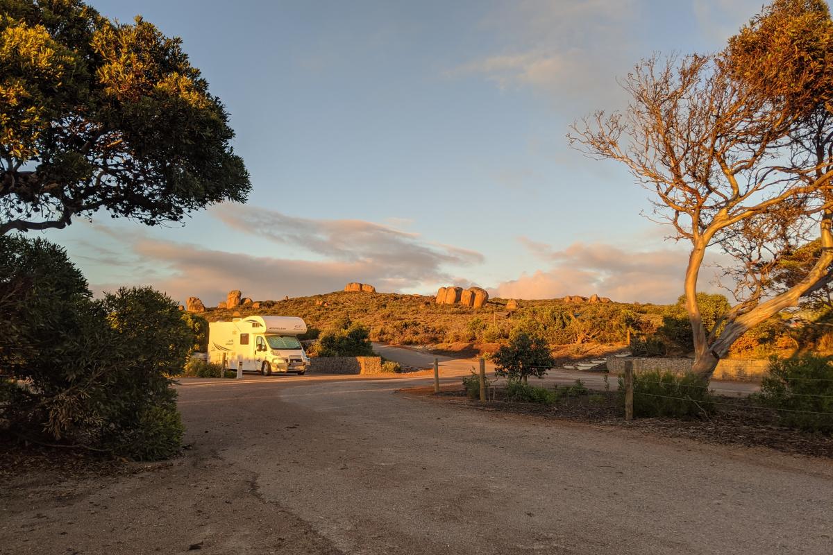 Campervan at a campground in the early morning light
