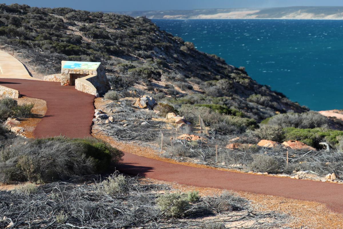Red Bluff Kalbarri National Park Visitors walking along bitumised path overlooking Red Bluff beach
