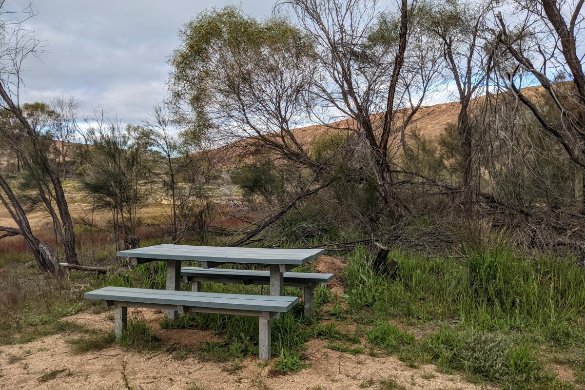 Picnic bench near granite outcrop