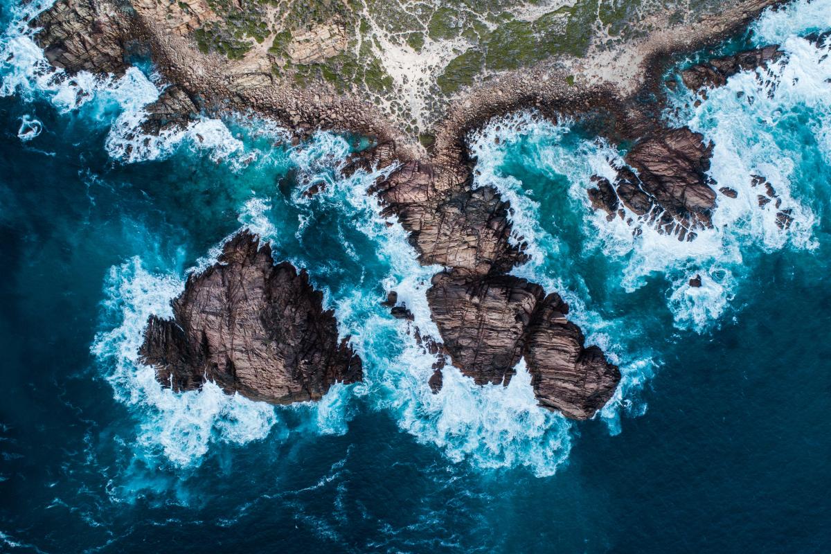 view flying over the coast at sugarloaf rock headlands