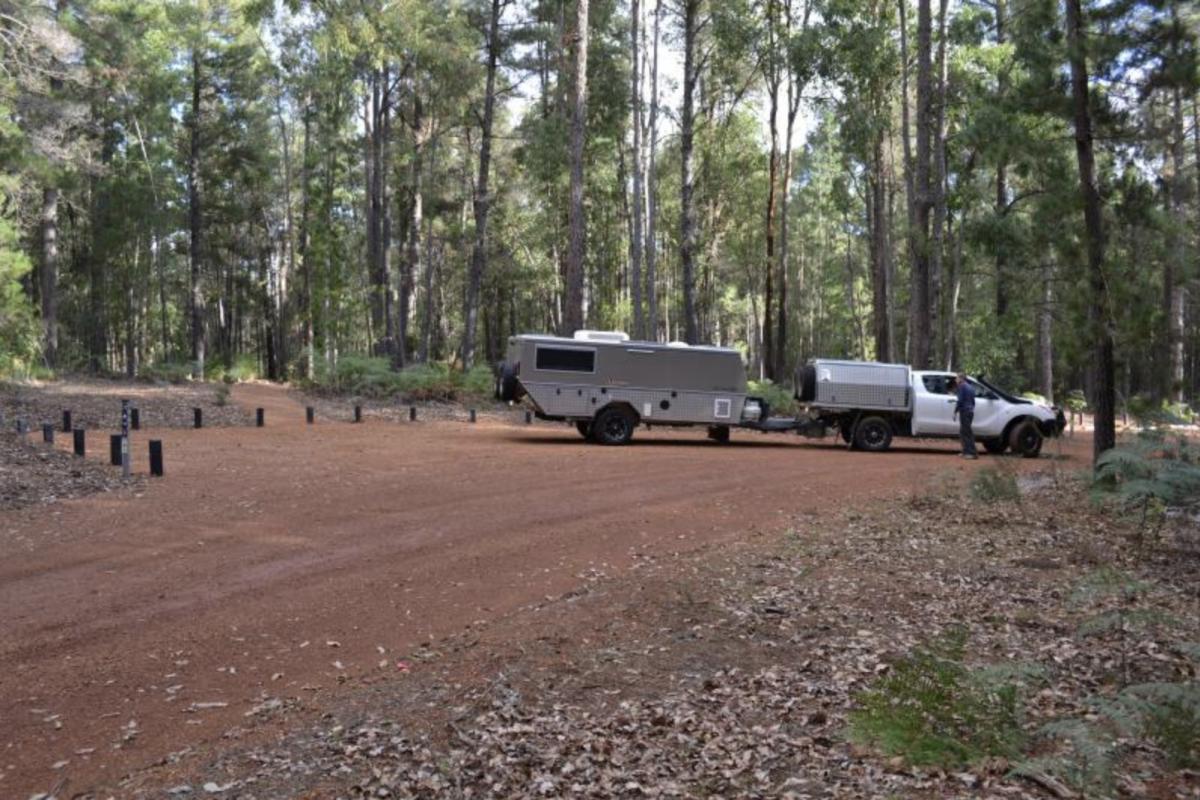 Baden Powell Campground. a person with their vehicle and camper trailer at baden powell campground