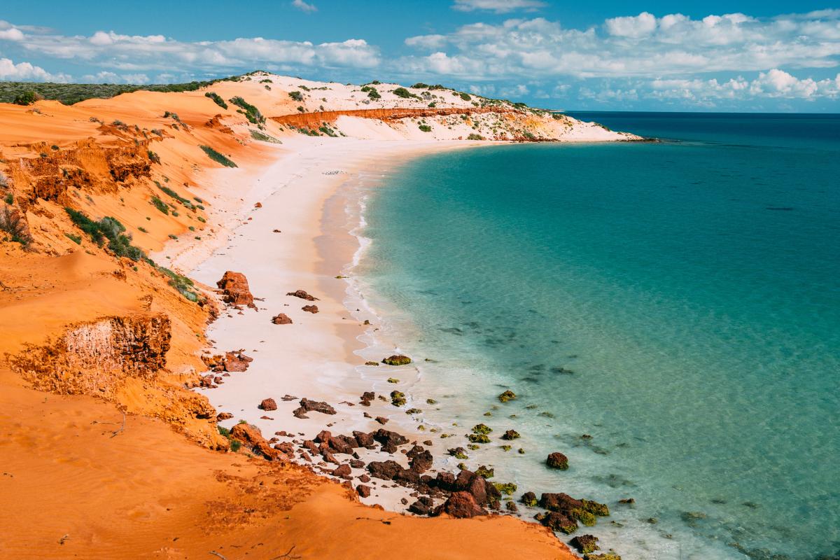 Cape Peron, Francois Peron National Park Colourful coastal bay of red dirt, white sand and calm green blue ocean.