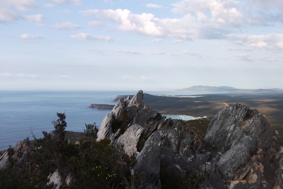 elevated view of imposing rock formations at East Mount Barren with coastal rocky landscape in the distance