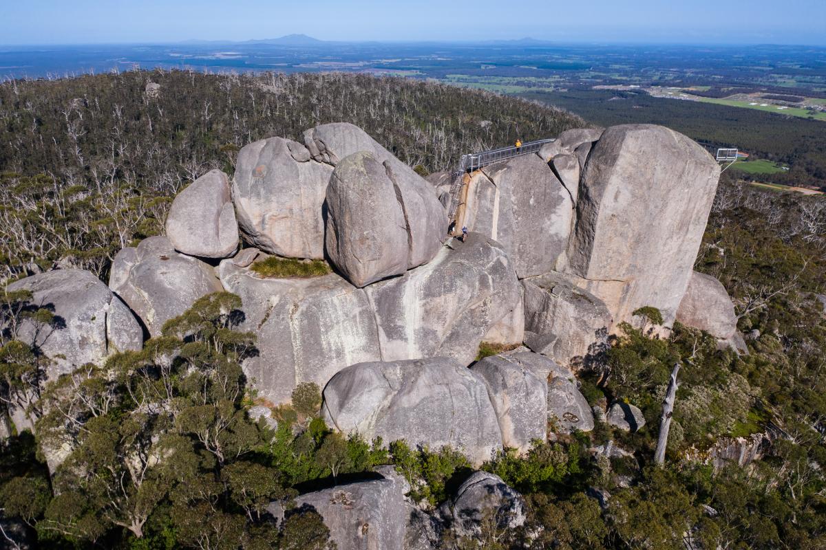 Granite Skywalk at Castle Rock, Porongorup National Park. a person walking on the granite skywalk