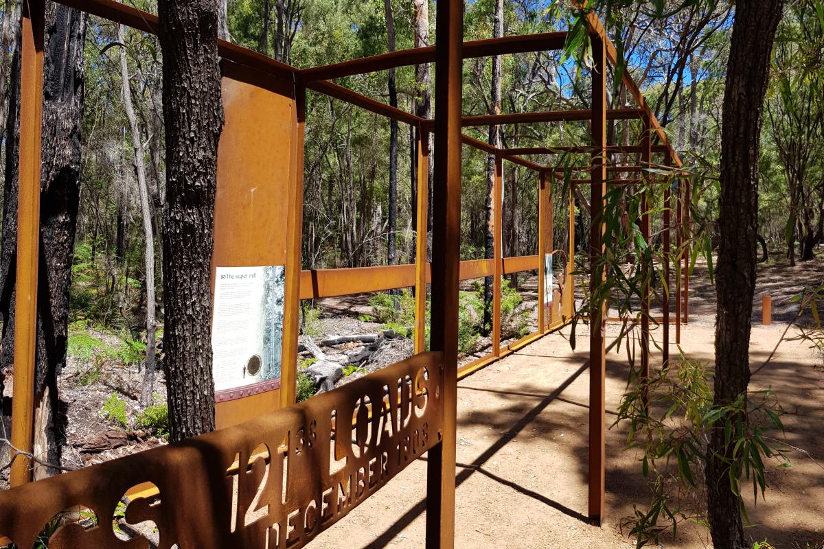 Jarrahdene walk trail at Jarrahdene Campground sculpture of cubic meters of wood that was logged from a tree