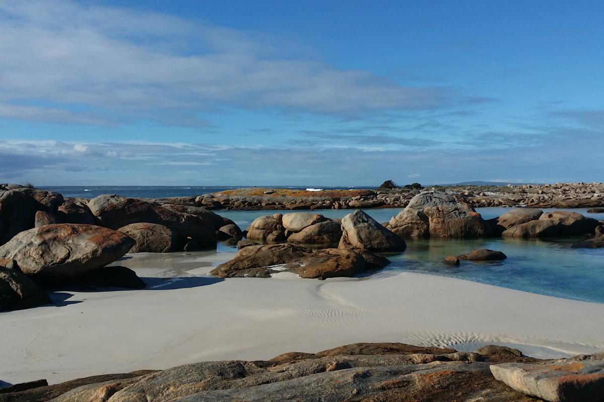 boulders on the white sandy beach at jorndee creek