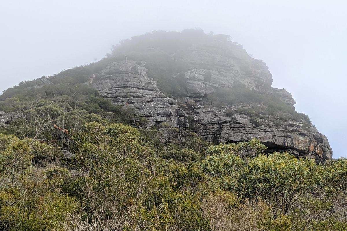 Two hikers on Mount Hassell in the cloud