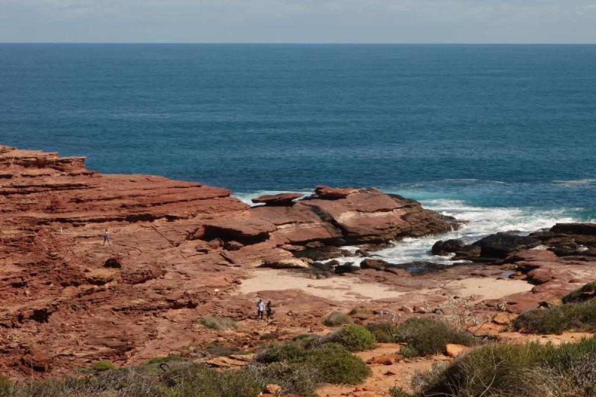 elevated ocean view over expansive red sandstone rocks
