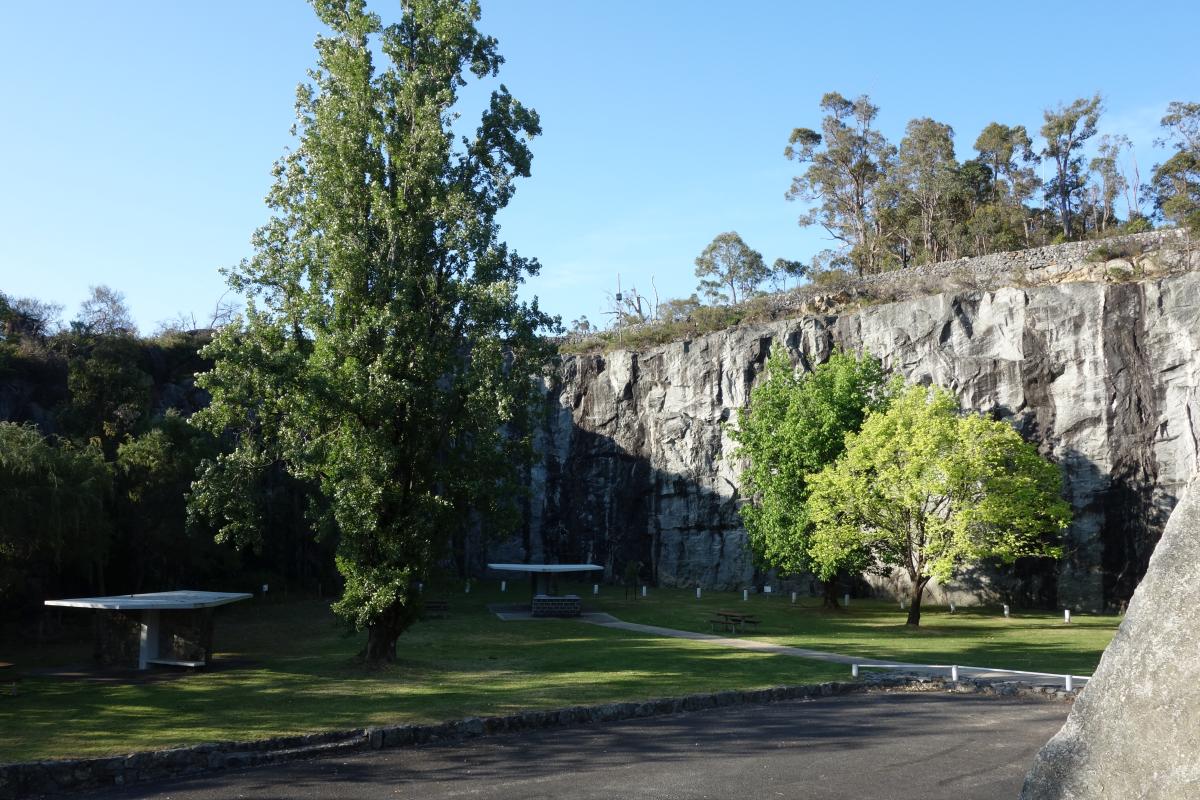 lawn and trees in a quarry that has picnic area