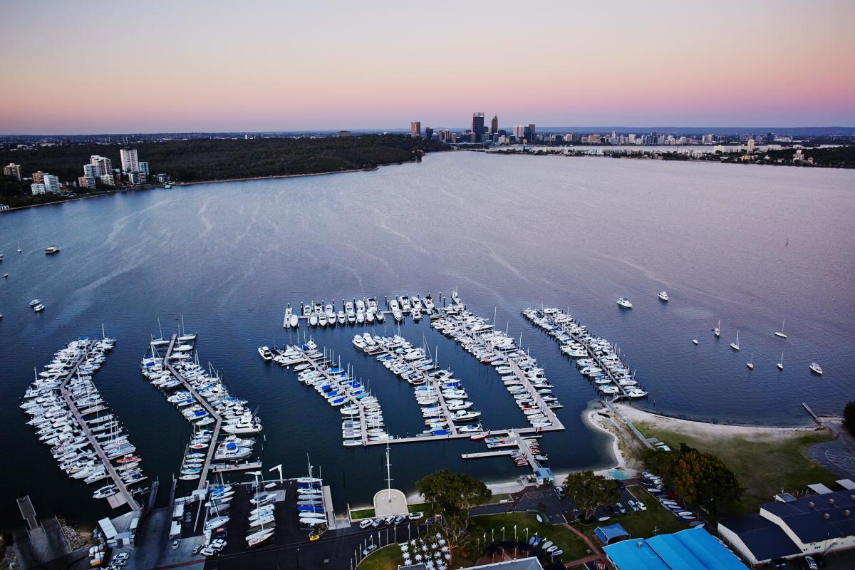 Perth city on the Swan River Aerial view of Swan River and Perth city skyline at sunset