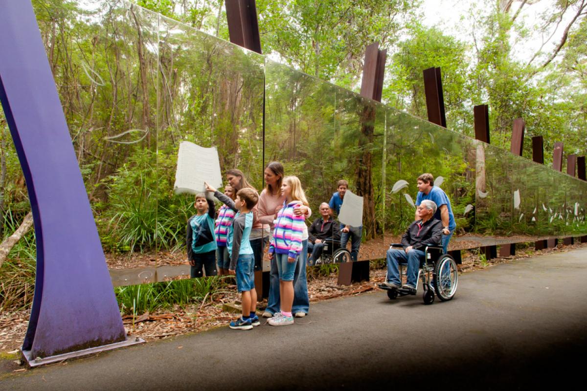 Swarbrick wall of perception at Swarbrick. people in front of the mirrored wall at swarbrick