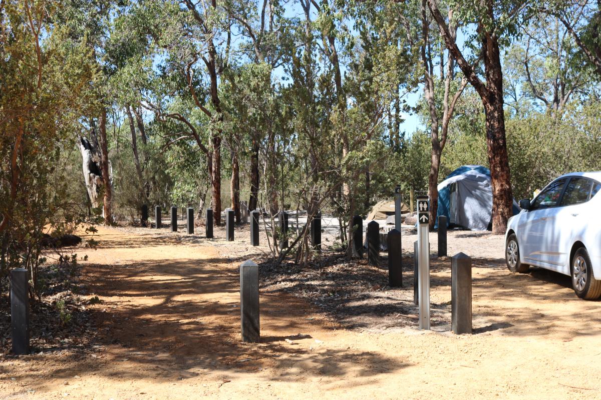 tents and a vehicle in the campground