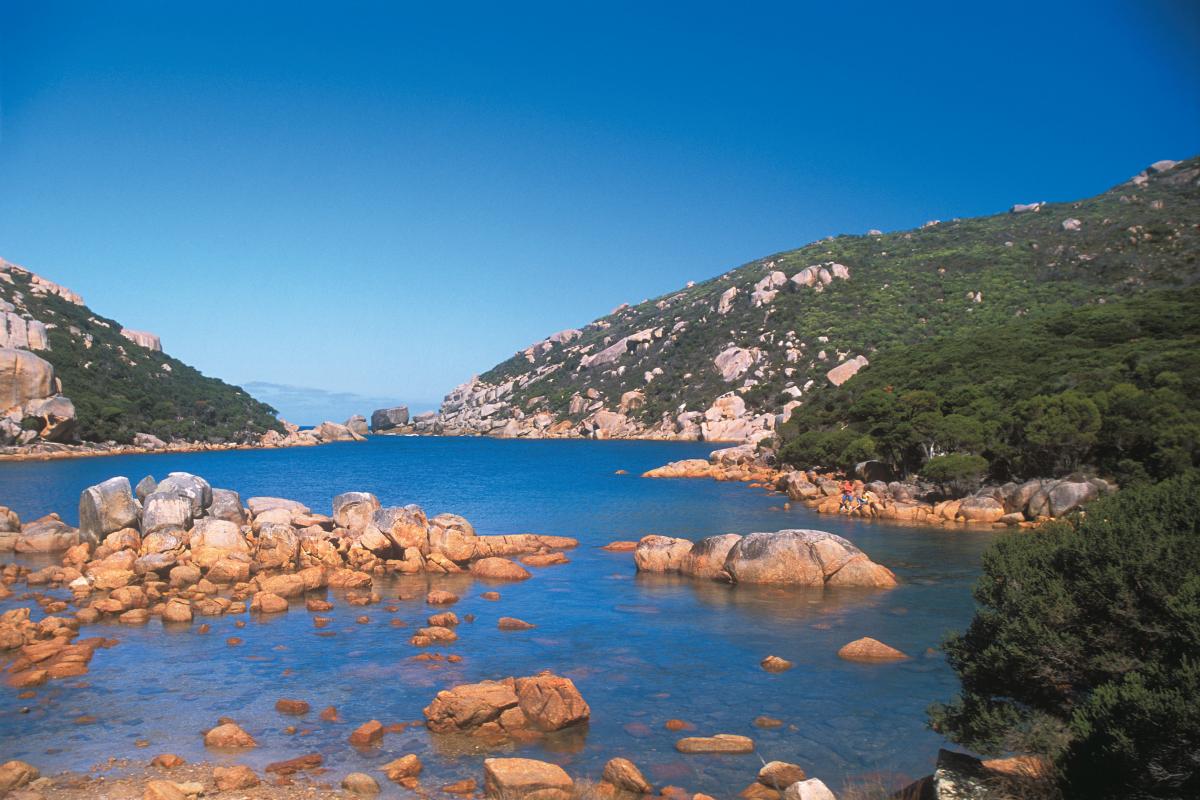 View of rocks and clear green ocean water 