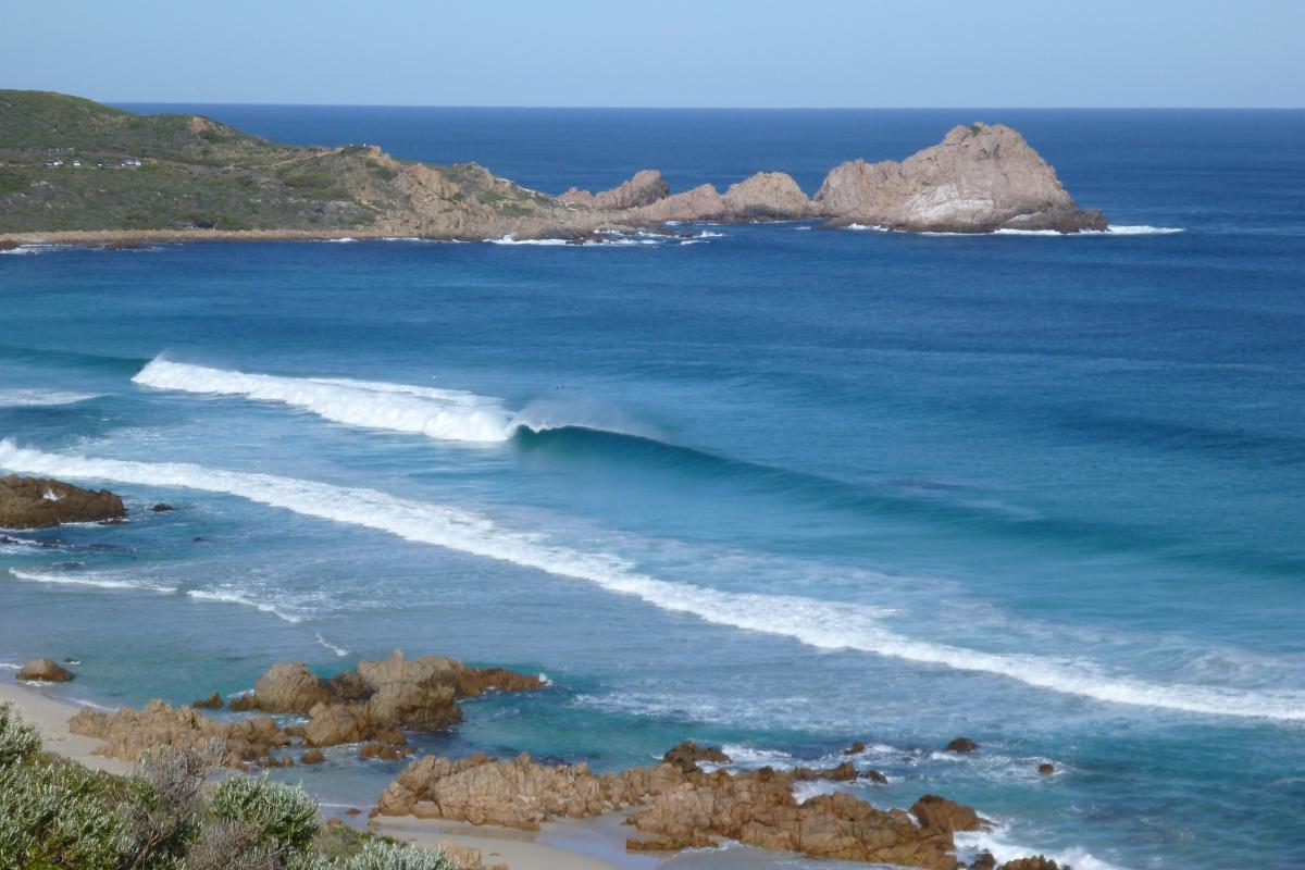 surf rolling in at windmills surf break