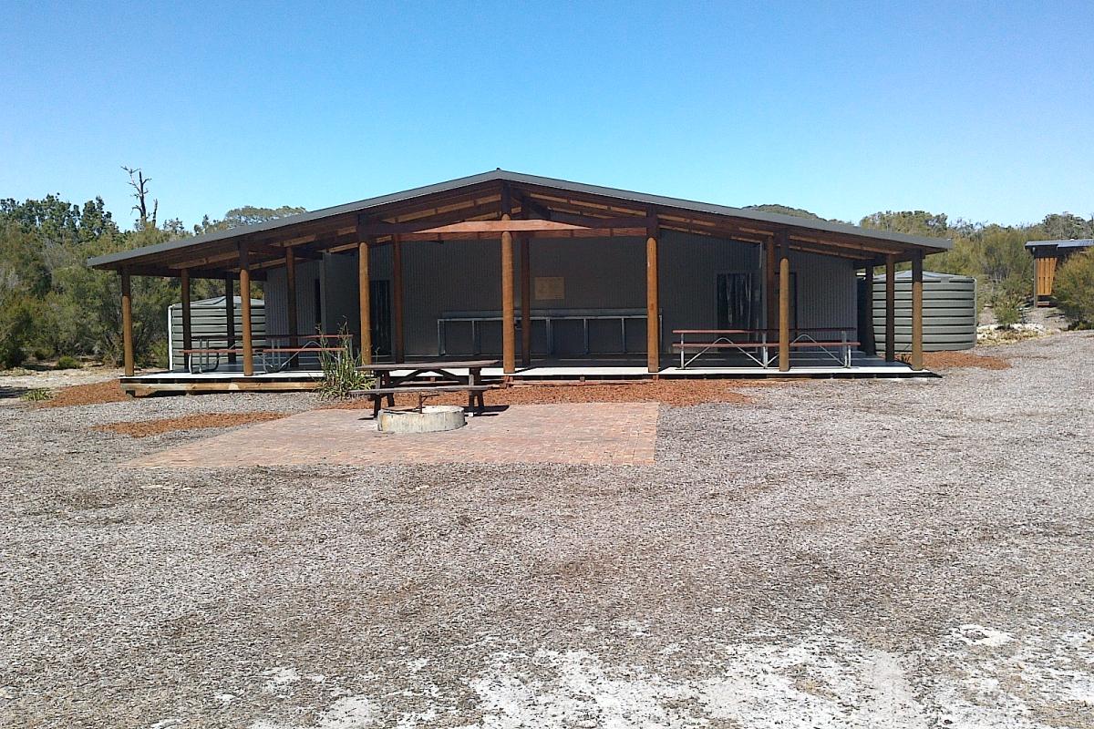 ground level building for camping in with blue skies