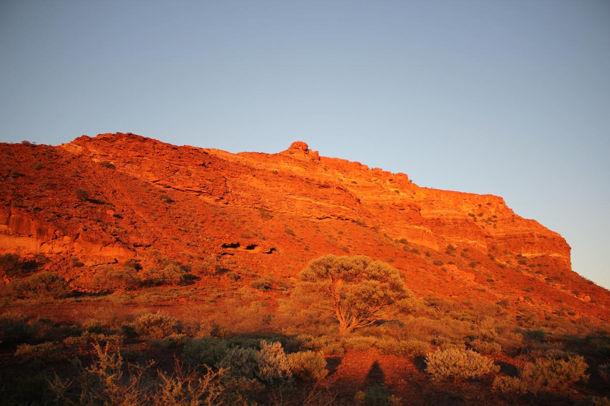 the escarpment glows a bright red at sunrise
