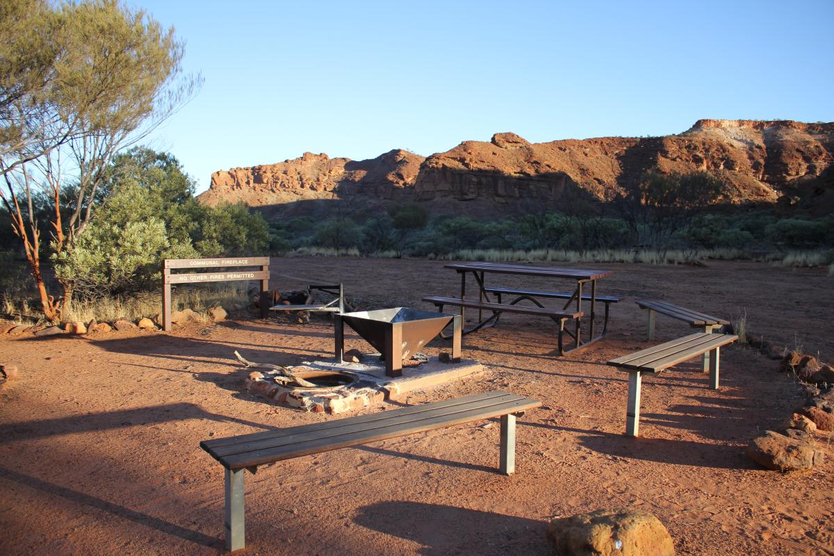 seating area around the communal fire pit in the campground