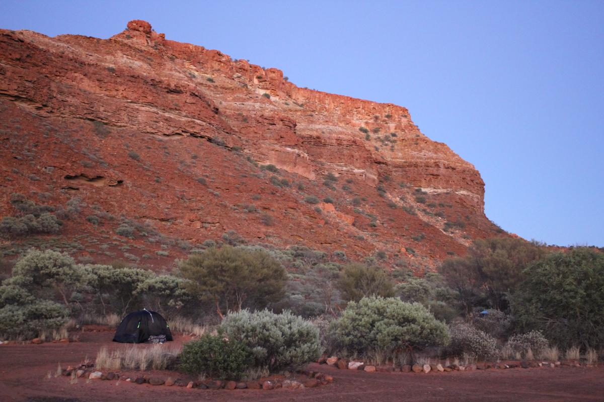 tent with the escarpment in the background