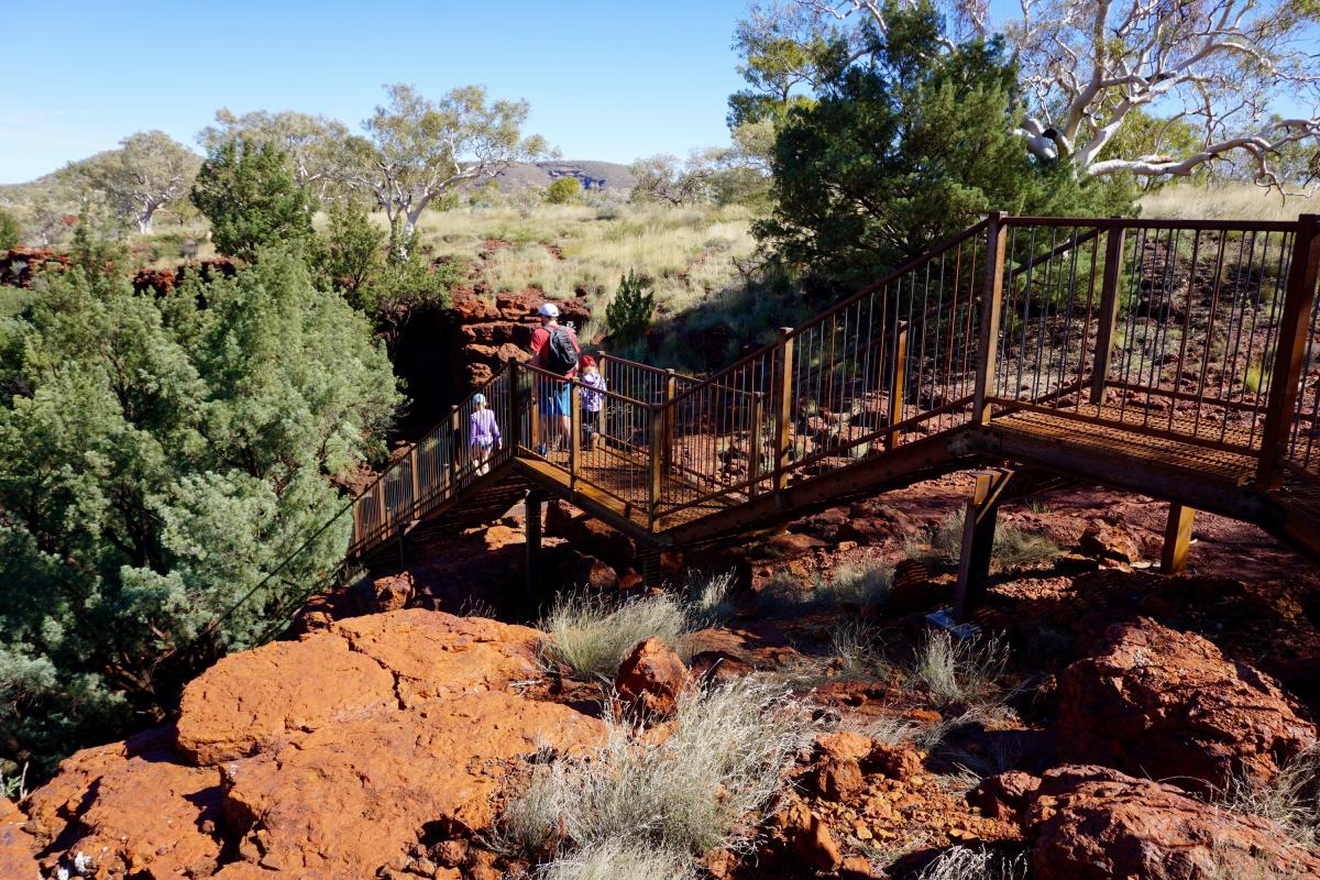 people walking down the stair case into dales gorge