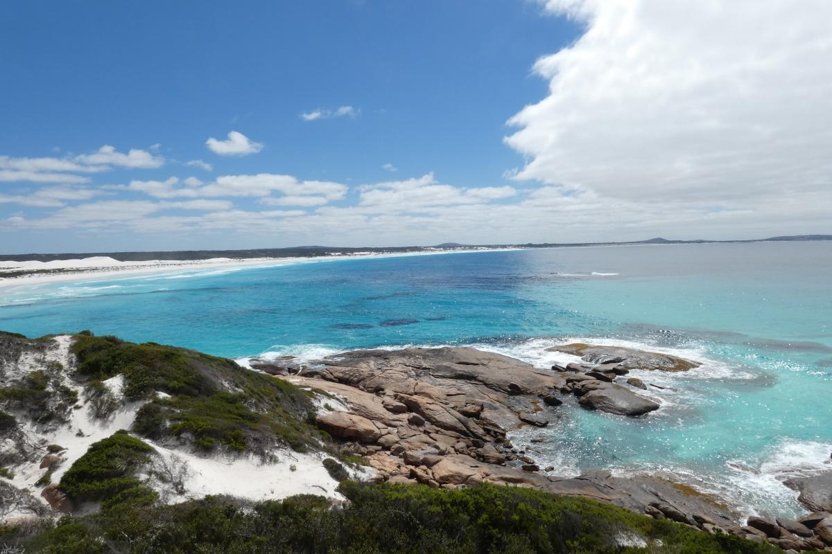 rugged coastline with rocks spilling into the ocean