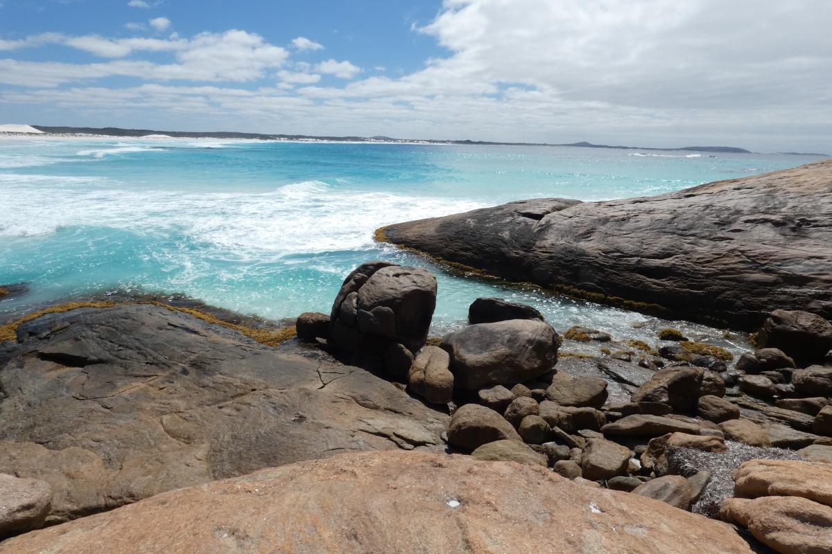 weathered rocks beside a turquoise ocean at Dunn Rocks