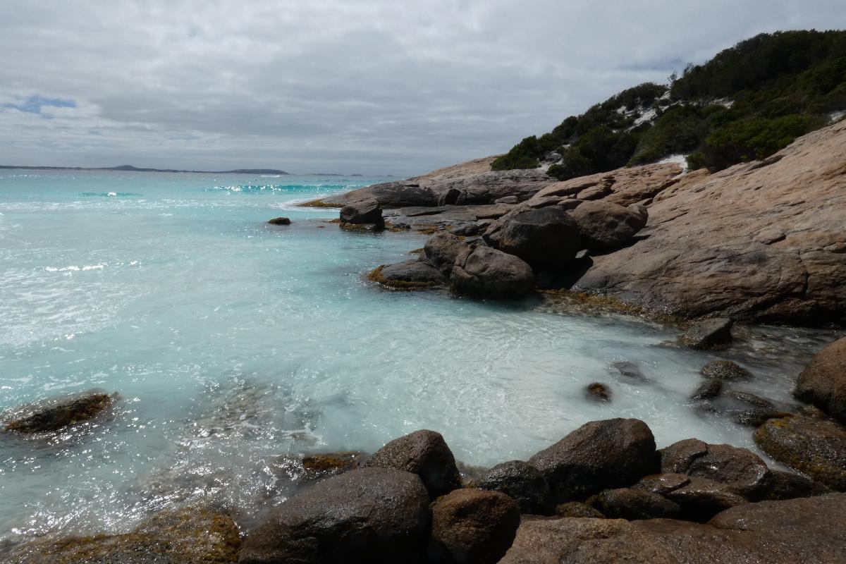 ocean lapping at a rocky coastline