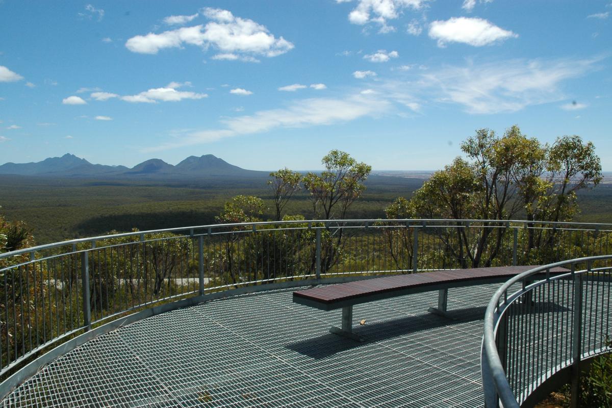 Lookout structure with seating with outstanding views of distant peaks.