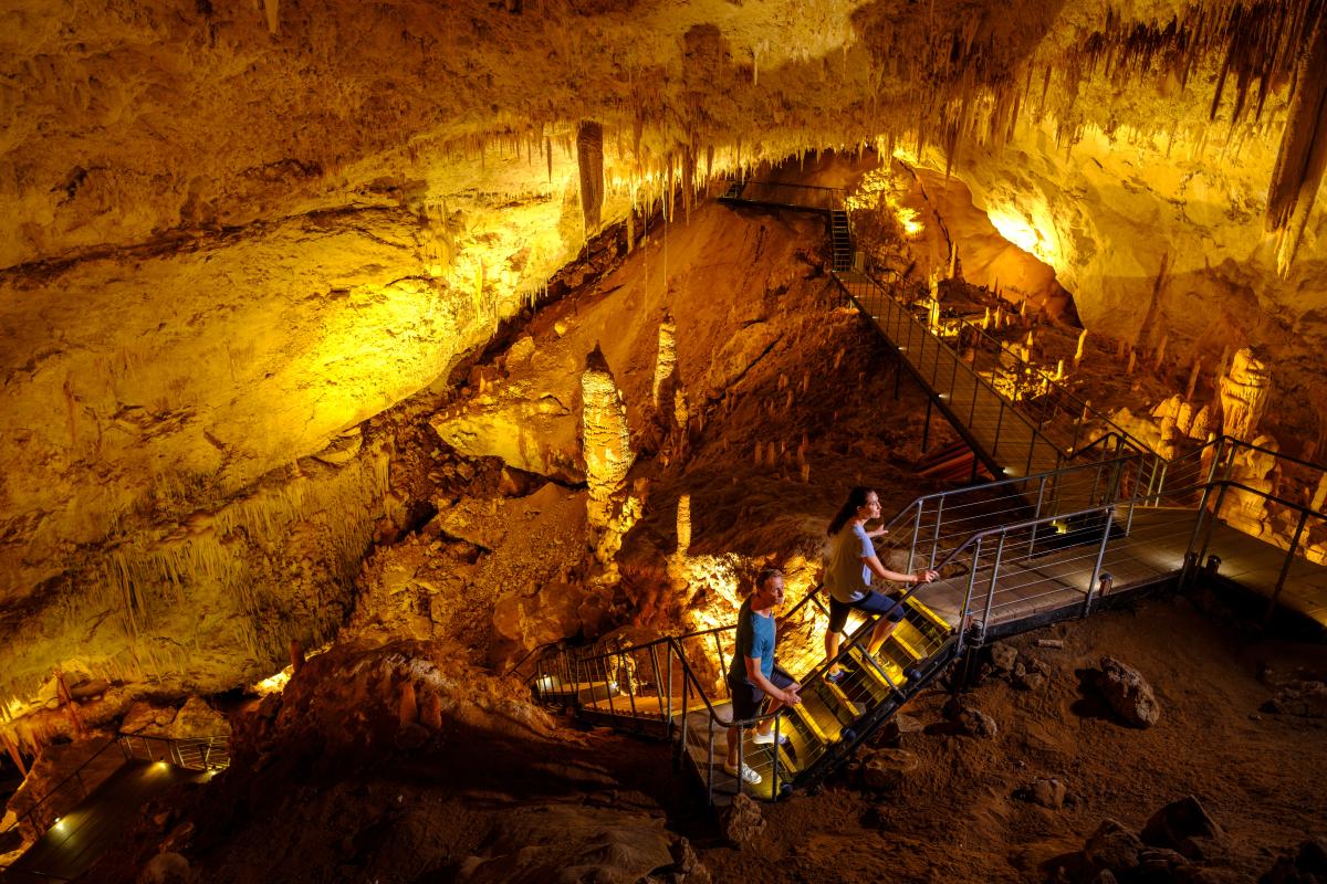 Jewel Cave Couple walking up stairs in Jewel Cave