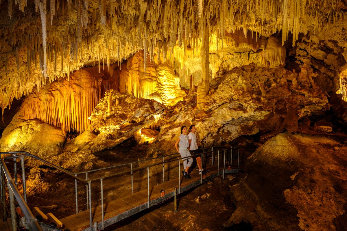 Jewel Cave Couple standing in Jewel Cave.