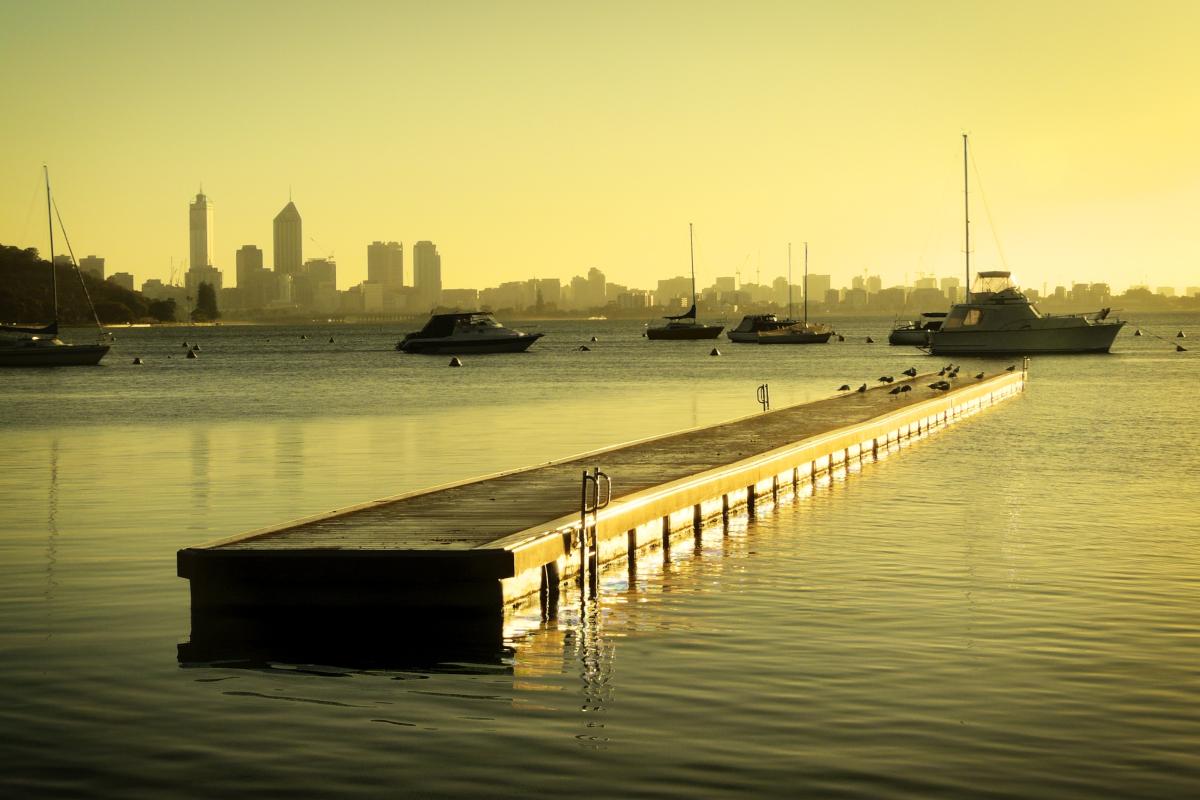 View of jetty at Matilda Bay with the city skyline in the background. 